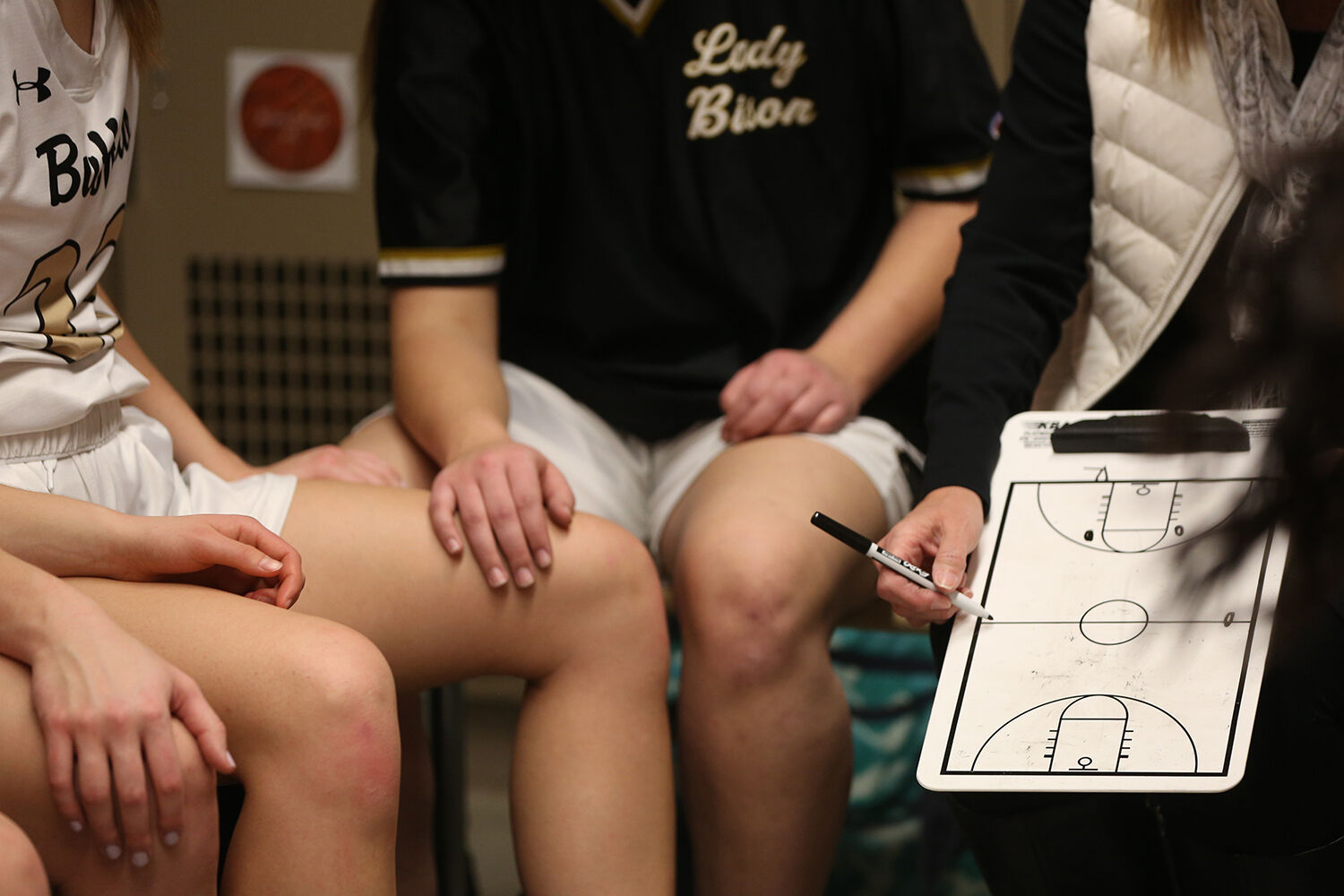 Michelle Dahlberg talks with the team over halftime